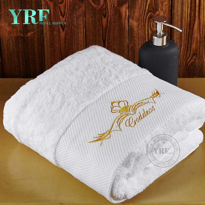 Asciugamani dell'hotel usati di alta qualità su ordine di lusso bianco puro puro del cotone di 100%